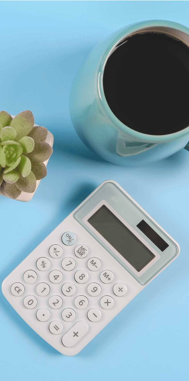 Cup of coffee and calculator