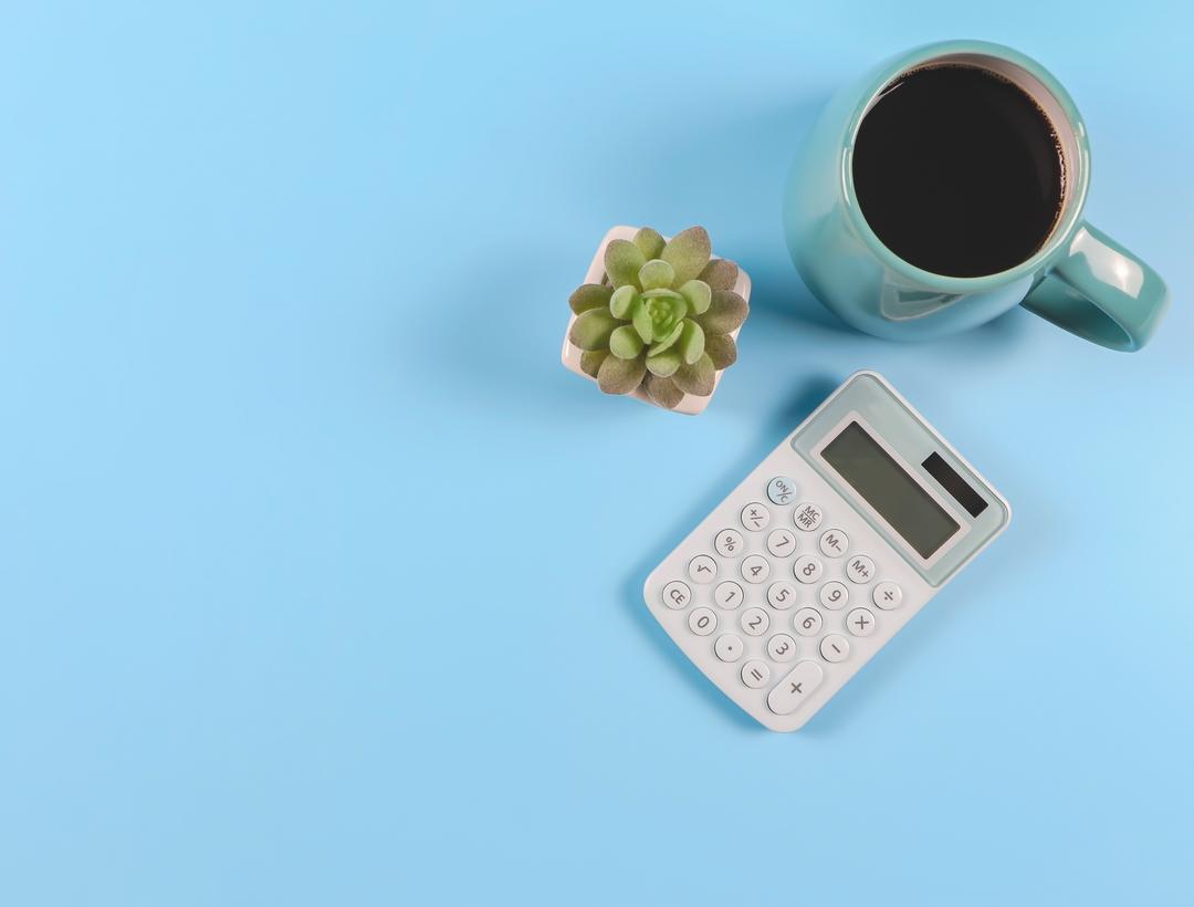 Cup of coffee and calculator
